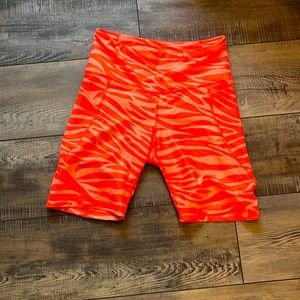 Neon orange zebra pattern biker shorts